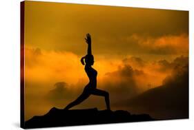 Silhouette of Woman Doing Yoga Meditation During Sunrise with Natural Golden Sunlight on Mountain-szefei-Stretched Canvas