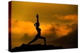 Silhouette of Woman Doing Yoga Meditation During Sunrise with Natural Golden Sunlight on Mountain-szefei-Stretched Canvas