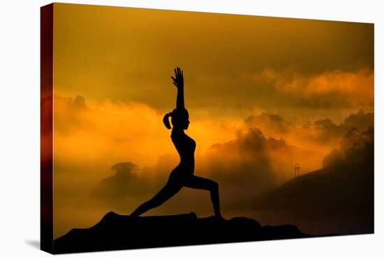 Silhouette of Woman Doing Yoga Meditation During Sunrise with Natural Golden Sunlight on Mountain-szefei-Stretched Canvas