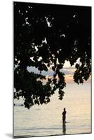 Silhouette of Woman Wading at Sea at Sunset, Anse L' Islette, Seychelles, Indian Ocean Islands-Guido Cozzi-Mounted Photographic Print