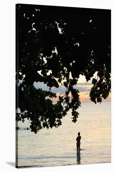 Silhouette of Woman Wading at Sea at Sunset, Anse L' Islette, Seychelles, Indian Ocean Islands-Guido Cozzi-Stretched Canvas