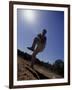 Silhouette of Young Boy in Action Pitching-null-Framed Photographic Print