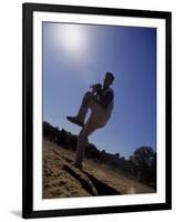 Silhouette of Young Boy in Action Pitching-null-Framed Photographic Print