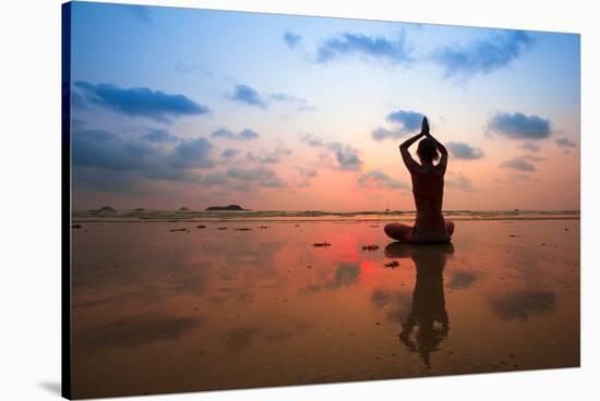 Silhouette Young Woman Practicing Yoga On The Beach At Sunset-De Visu-Stretched Canvas