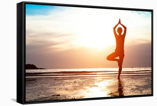 Silhouette Young Woman Practicing Yoga on the Beach at Sunset-De Visu-Framed Stretched Canvas