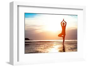 Silhouette Young Woman Practicing Yoga on the Beach at Sunset-De Visu-Framed Photographic Print