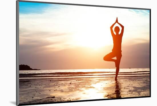 Silhouette Young Woman Practicing Yoga on the Beach at Sunset-De Visu-Mounted Photographic Print