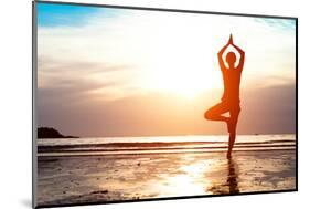 Silhouette Young Woman Practicing Yoga on the Beach at Sunset-De Visu-Mounted Photographic Print