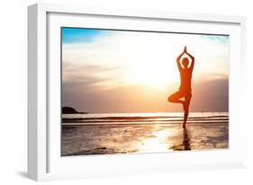 Silhouette Young Woman Practicing Yoga on the Beach at Sunset-De Visu-Framed Photographic Print