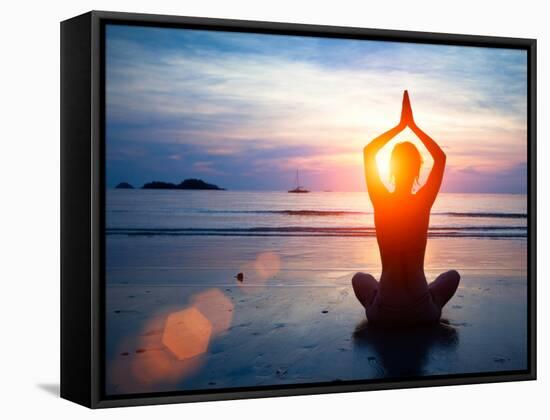 Silhouette Young Woman Practicing Yoga on the Beach at Sunset.-De Visu-Framed Stretched Canvas