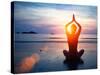 Silhouette Young Woman Practicing Yoga on the Beach at Sunset.-De Visu-Stretched Canvas