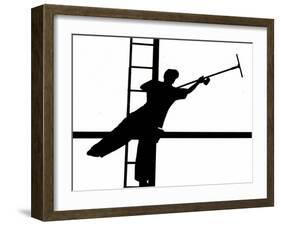 Silhouetted against the Bright Morning Sun, a Window Cleaner Stretches to Clean a Spot-null-Framed Photographic Print