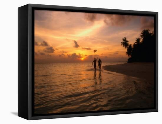 Silhouetted Couple, Felidu Atoll, Maldives-Stuart Westmorland-Framed Stretched Canvas