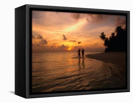 Silhouetted Couple, Felidu Atoll, Maldives-Stuart Westmorland-Framed Stretched Canvas