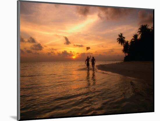 Silhouetted Couple, Felidu Atoll, Maldives-Stuart Westmorland-Mounted Photographic Print