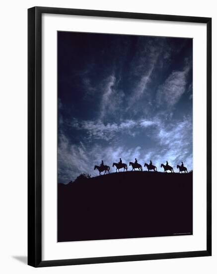 Silhouetted Cowboys During Round Up at Trinchera Ranch-Loomis Dean-Framed Photographic Print