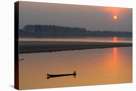 Silhouetted Man in Longtail Boat Along the Mekong River-null-Stretched Canvas