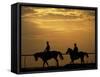 Silhouetted Men Riding on Horses, Dubai, UAE-Henry Horenstein-Framed Stretched Canvas