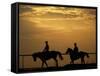 Silhouetted Men Riding on Horses, Dubai, UAE-Henry Horenstein-Framed Stretched Canvas