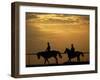 Silhouetted Men Riding on Horses, Dubai, UAE-Henry Horenstein-Framed Photographic Print