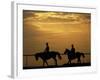 Silhouetted Men Riding on Horses, Dubai, UAE-Henry Horenstein-Framed Photographic Print