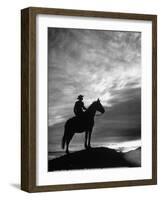 Silhouettes of Cowboy Mounted on Horse-Allan Grant-Framed Photographic Print