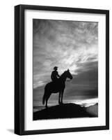 Silhouettes of Cowboy Mounted on Horse-Allan Grant-Framed Photographic Print