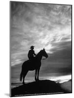 Silhouettes of Cowboy Mounted on Horse-Allan Grant-Mounted Photographic Print