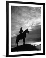 Silhouettes of Cowboy Mounted on Horse-Allan Grant-Framed Photographic Print