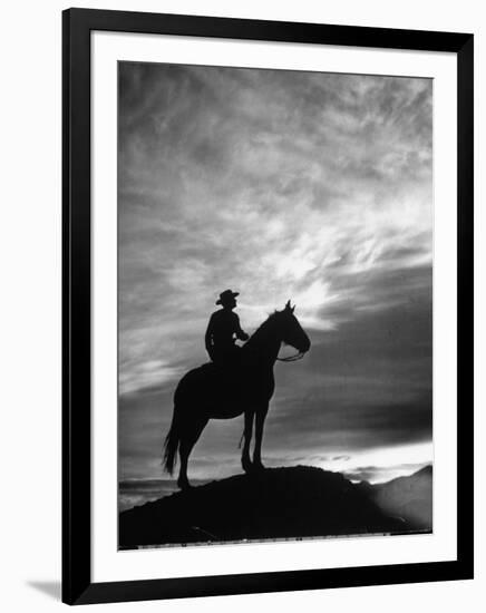 Silhouettes of Cowboy Mounted on Horse-Allan Grant-Framed Photographic Print