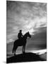 Silhouettes of Cowboy Mounted on Horse-Allan Grant-Mounted Photographic Print