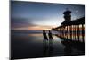 Silhouettes of surfers at Huntington Beach Pier at sunset, California, USA-Panoramic Images-Mounted Photographic Print