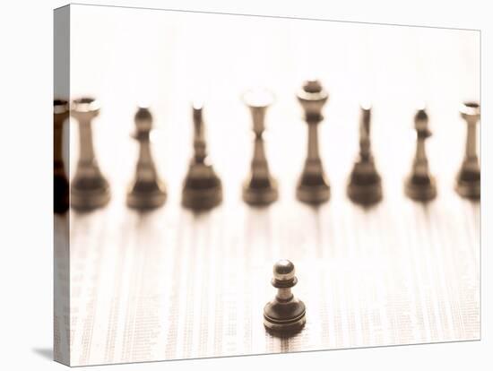 Silver Pawn on Newspaper Stock Market Report with Line of Chess Pieces-null-Stretched Canvas