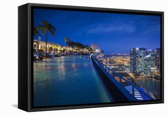 Singapore, Marina Bay Sands Hotel, Rooftop Swimming Pool, Dusk-Walter Bibikow-Framed Stretched Canvas