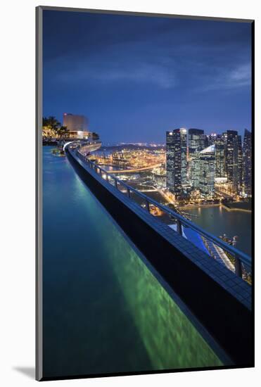 Singapore, Rooftop Swimming Pool at Dusk Overlooks the City-Walter Bibikow-Mounted Photographic Print