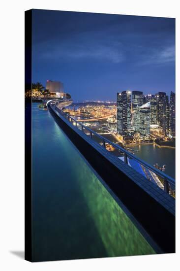 Singapore, Rooftop Swimming Pool at Dusk Overlooks the City-Walter Bibikow-Stretched Canvas