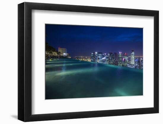 Singapore, Rooftop Swimming Pool at Dusk Overlooks the City-Walter Bibikow-Framed Photographic Print