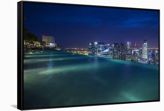 Singapore, Rooftop Swimming Pool at Dusk Overlooks the City-Walter Bibikow-Framed Stretched Canvas