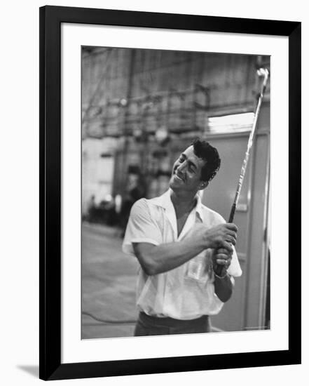 Singer and Actor Dean Martin holding a pitching club on Movie Set for MGM's "Some Came Running"-Allan Grant-Framed Premium Photographic Print