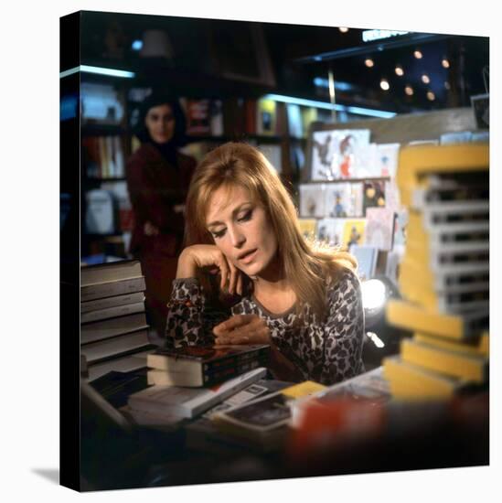 Singer Dalida in a Bookshop, C. 1968-null-Stretched Canvas
