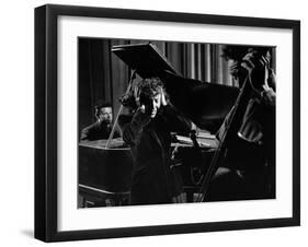 Singer Edith Piaf Holding Her Hands to Her Head While Performing with Pianist and Bass Player-Gjon Mili-Framed Premium Photographic Print