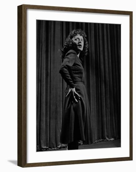 Singer Edith Piaf with Hands on Hips, Standing on Stage-Gjon Mili-Framed Premium Photographic Print