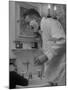 Singer Ezio Pinza, at Home with His Son, Singing and Shaving in the Bathroom-Nina Leen-Mounted Premium Photographic Print