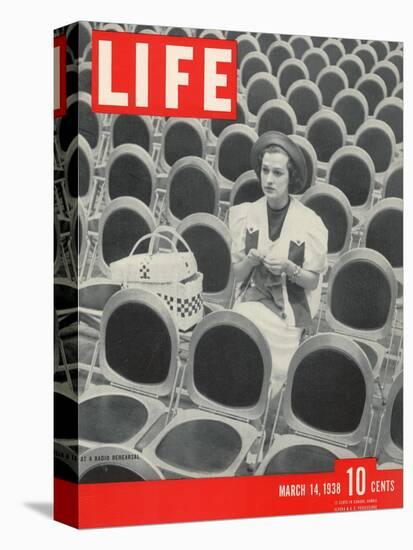 Singer Jane Froman Knitting Among Empty Seats at Radio Rehearsal in NBC's Studio, March 14, 1938-Alfred Eisenstaedt-Stretched Canvas