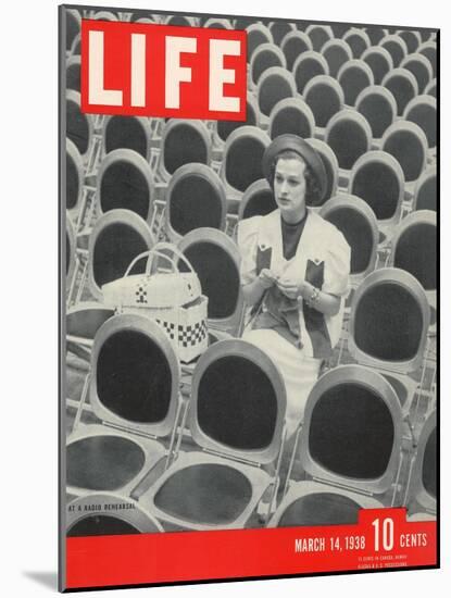 Singer Jane Froman Knitting Among Empty Seats at Radio Rehearsal in NBC's Studio, March 14, 1938-Alfred Eisenstaedt-Mounted Photographic Print