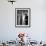 Singer Julie Wilson on Phone Beside Closet with Hanging Evening Dresses and Wigs on Top Shelf-Nina Leen-Framed Premium Photographic Print displayed on a wall