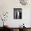 Singer Julie Wilson on Phone Beside Closet with Hanging Evening Dresses and Wigs on Top Shelf-Nina Leen-Mounted Premium Photographic Print displayed on a wall