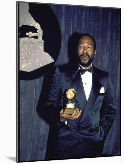 Singer Marvin Gaye Holding His Award in Press Room at Grammy Awards-null-Mounted Premium Photographic Print