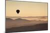 Single Hot Air Balloon over a Misty Dawn Sky, Cappadocia, Anatolia, Turkey, Asia Minor, Eurasia-David Clapp-Mounted Photographic Print