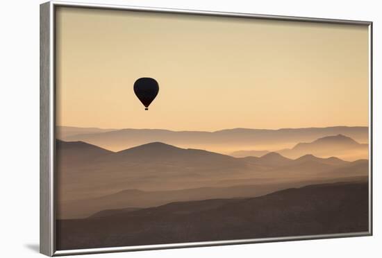 Single Hot Air Balloon over a Misty Dawn Sky, Cappadocia, Anatolia, Turkey, Asia Minor, Eurasia-David Clapp-Framed Photographic Print